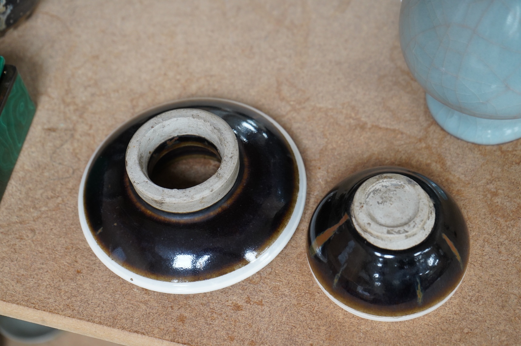 A Chinese crackle glaze arrow vase and a black and russet glazed tea bowl on stand, largest 22cm high